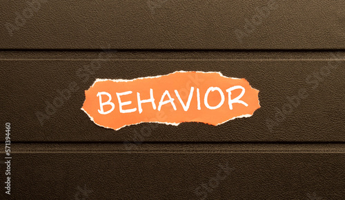 word BEHAVIOR on red torn paper, business concept photo