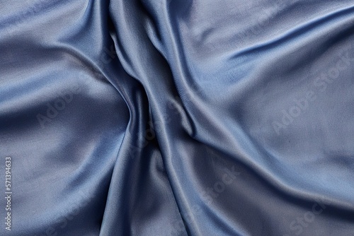 Draped dark blue silk fabric background texture