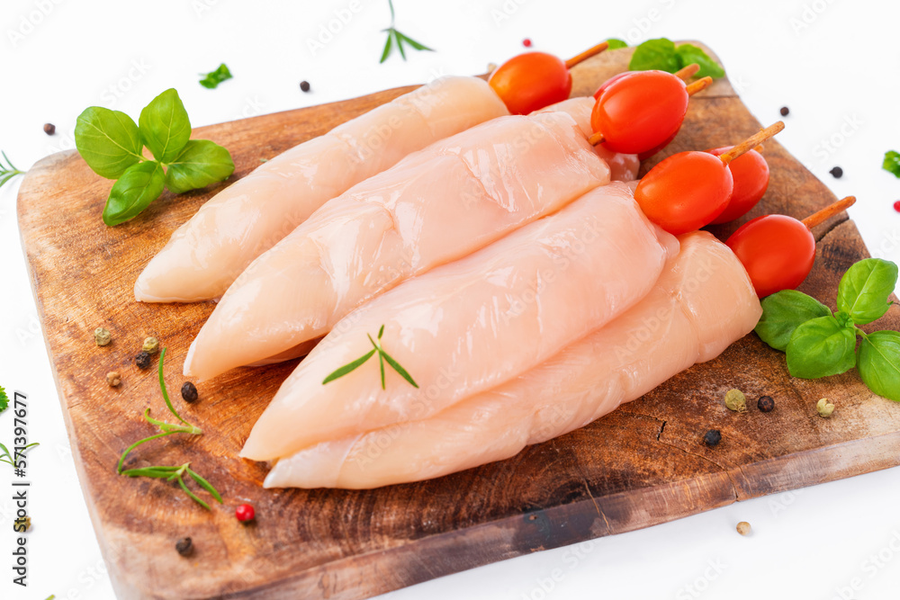Raw chicken inner on skewers with tomatoes white background with spices, herbs.Raw uncooked Chicken meat,kebab on skewers.skewers raw meat and vegetables.Top view.Chicken Skewers breast fillet meat. Raw chicken inner on skewers with tomatoes white background with spices, herbs.Raw uncooked Chicken meat,kebab on skewers.skewers raw meat and vegetables.Top view.Chicken Skewers breast fillet meat.