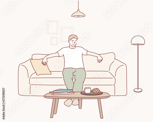 Happy man sitting on comfortable couch at home in living room. Cheerful casual man relaxing on sofa, enjoying weekend free time or break from work. Hand drawn style vector design illustrations.
