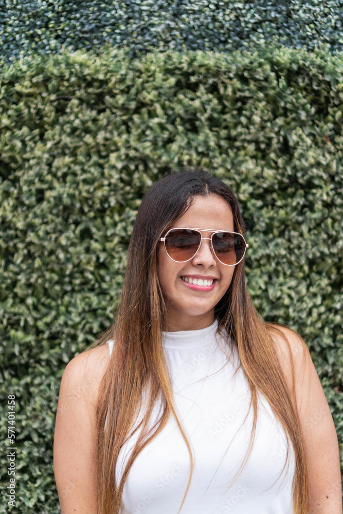 woman with white shirt smiling at camera woman with white shirt smiling at camera