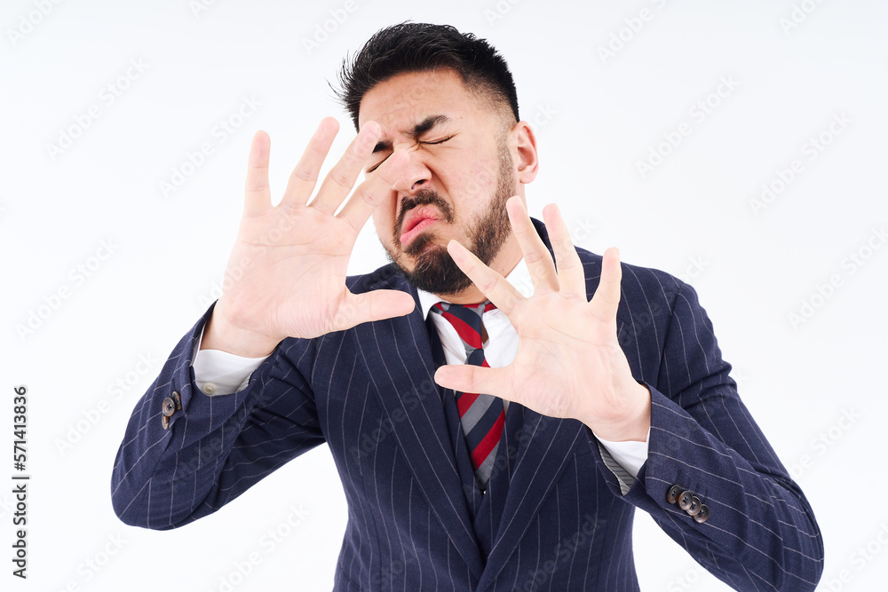 拒絶のポーズをするスーツ姿の男性 Stock Photo | Adobe Stock