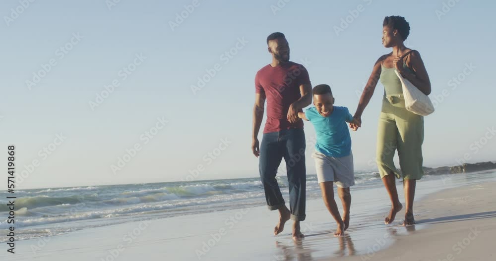 Video of happy african american family having fun on beach Video of happy african american family having fun on beach