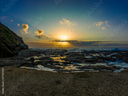 Sunrise over the ocean and rock platform