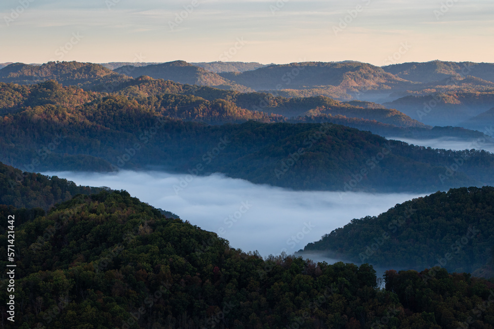 Sunrise and Foggy Mountains