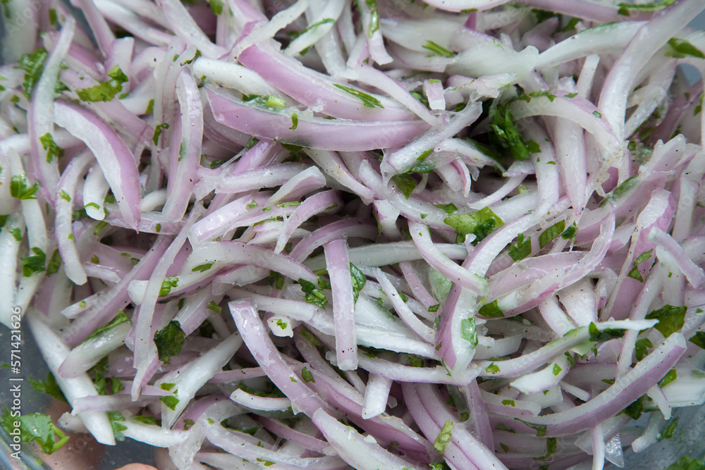 Red onion chopped in thin slices for meal preparation peruvian food zarza criolla Red onion chopped in thin slices for meal preparation peruvian food zarza criolla