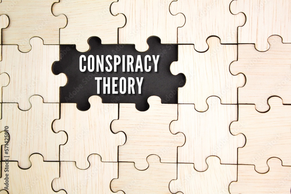Fototapeta premium wooden puzzle with the word CONSPIRACY THEORY