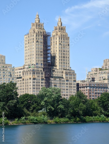 long exposure photo of a view of the city towers from the river from the central park in a day of spring, manhattan island, new york city nature plants and outdoors 