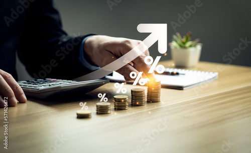 interest rates and dividends, Business people calculate and higher graphs and percentages investment returns, stock return income, retirement Compensation fund, investment, dividend tax photo