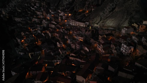 Aerial shot of a fairytale city drowned in darkness. Pietrapertosa, Italy, Europe