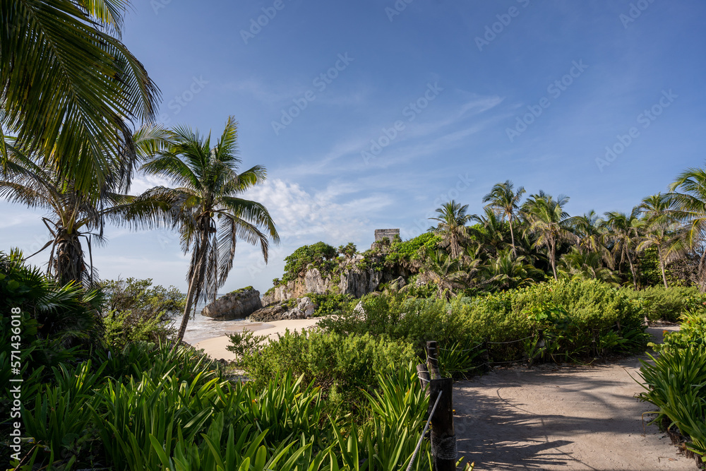 The ruins of a beautiful pyramid in the archaeological zone of Tulum in Mexico.