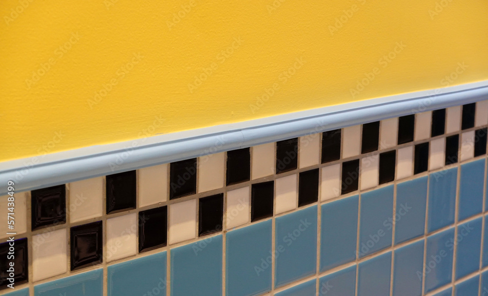 Colorful ceramic tile wall in bathroom with yellow and blue color. Colorful ceramic tile wall in bathroom with yellow and blue color.