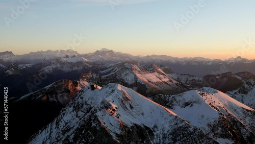 Snow-Covered Moleson Summit At Sunset With The Swiss Alps In Background In The Canton Of Fribourg, Switzerland. Aerial Shot photo