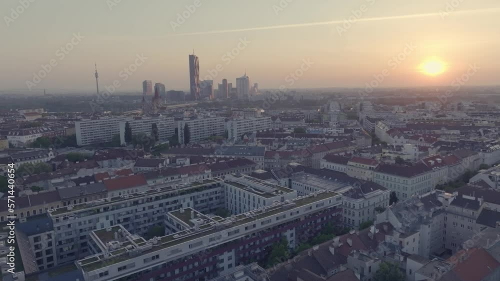 Ascending aerial shot of Vienna´s skyline during sunset with skyscraper in the back. Ascending aerial shot of Vienna´s skyline during sunset with skyscraper in the back.