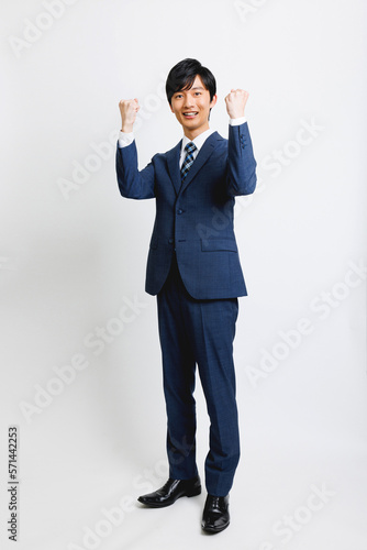Foto ガッツポーズをするビジネスマン