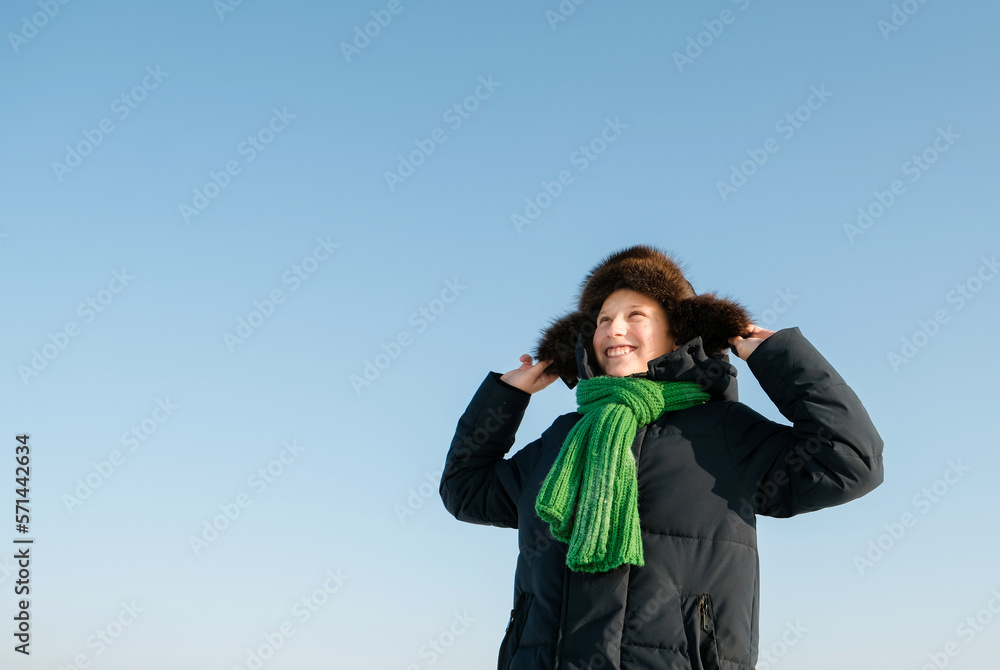 Portrait of boy in cap have fun, laugh and walk on winter background. Childhhod winter activity on sunny day outdoor. Happy moments of childhood. Copyspace
Portrait of boy in cap have fun, laugh and walk on winter background. Childhhod winter activity on sunny day outdoor. Happy moments of childhood. Copyspace