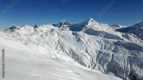 The mountain panorama of the snow-covered ski resort Rosswald in winter. Snowy mountain peaks. Aerial Shot photo