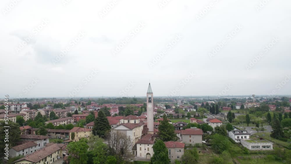 Aerial establishing shot of Capriate, Italy. Town center and buildings on cloudy day. Aerial establishing shot of Capriate, Italy. Town center and buildings on cloudy day.