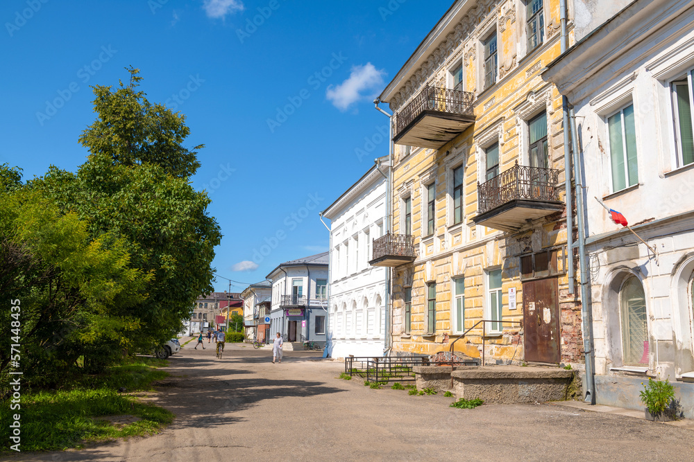 Sunny summer day on the street of provincial Ustyuzhna. Vologda Region