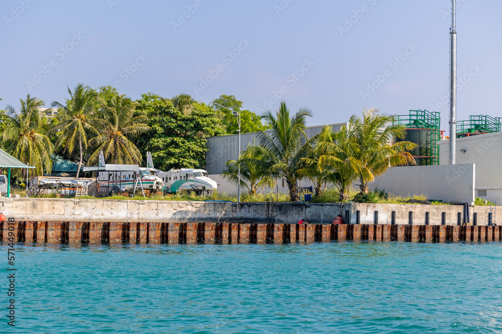 Jetty area with safari and boats with blue clear water and blue sky