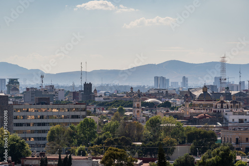 Beautiful view of the large Mexican city of Puebla. View of the endless mountain peaks around the city.