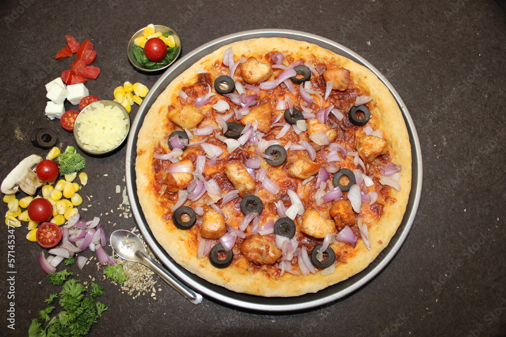 Indian Pizza with chicken, olives, onion etc.