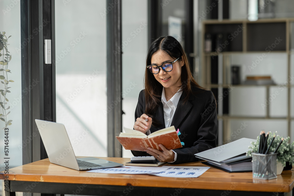 Female lawyer working at client's office discussing documents Female lawyer working at client's office discussing documents