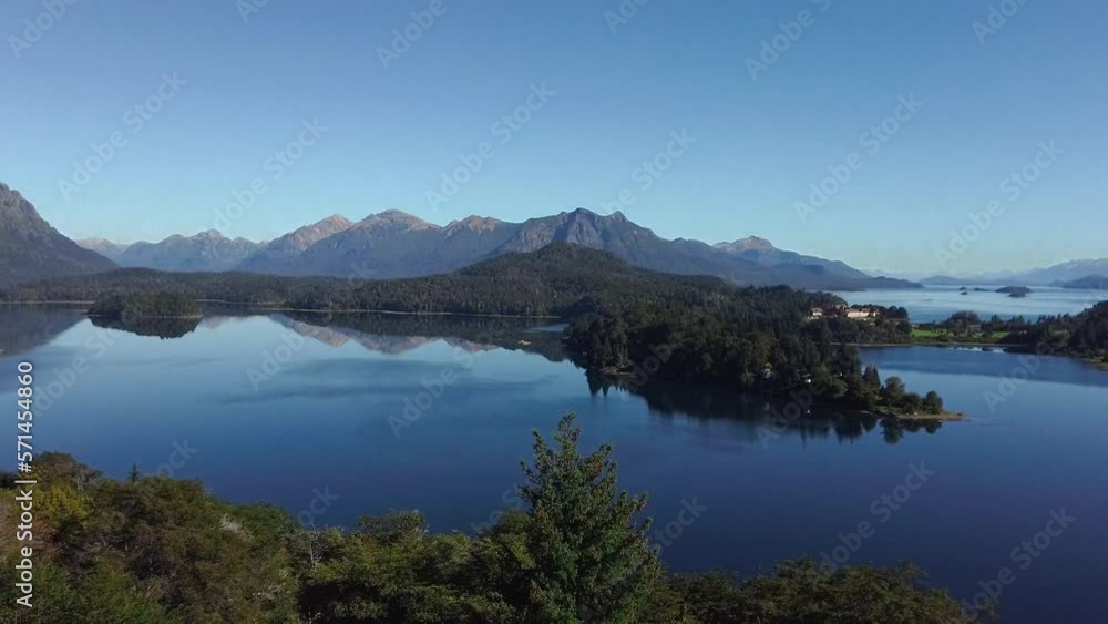Astonishing view of green mountain with a turquoise lake with the horizon serving as a reflection, Patagonia Astonishing view of green mountain with a turquoise lake with the horizon serving as a reflection, Patagonia