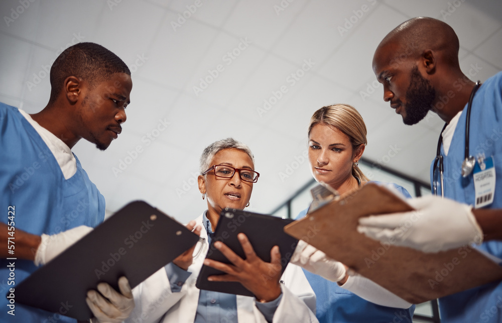 © Courtney/peopleimages.com - Tablet, teamwork and group of doctors in hospital management, results and medical data with manager. Nurse, professional healthcare people and technology of clinic review, planning or problem solving