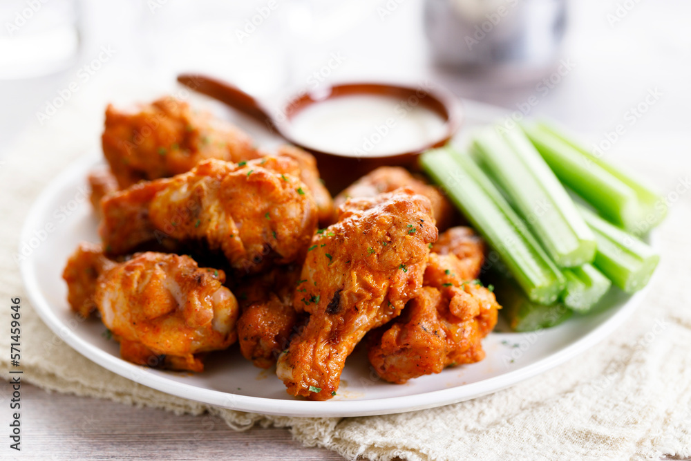 Barbecue chicken wings on a white plate. Barbecue chicken wings on a white plate.