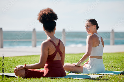 Yoga, park and young couple of friends or women for zen fitness, exercise and mindfulness, healing and support. Pilates training, workout people talking of health and body wellness together at beach