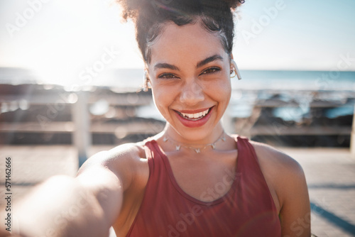 Fotografie Fitness, black woman and portrait smile for selfie, vlog or profile picture by beach for running exercise