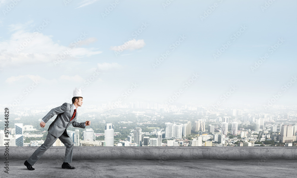 King businessman in elegant suit running on building roof and business center at background