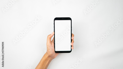 Hands holding blank screen smartphone for interface display