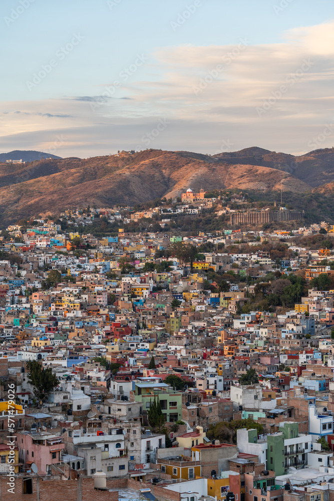 Very beautiful view of the city at sunset in the Mexican city of Guanajuato surrounded by large mountains.
