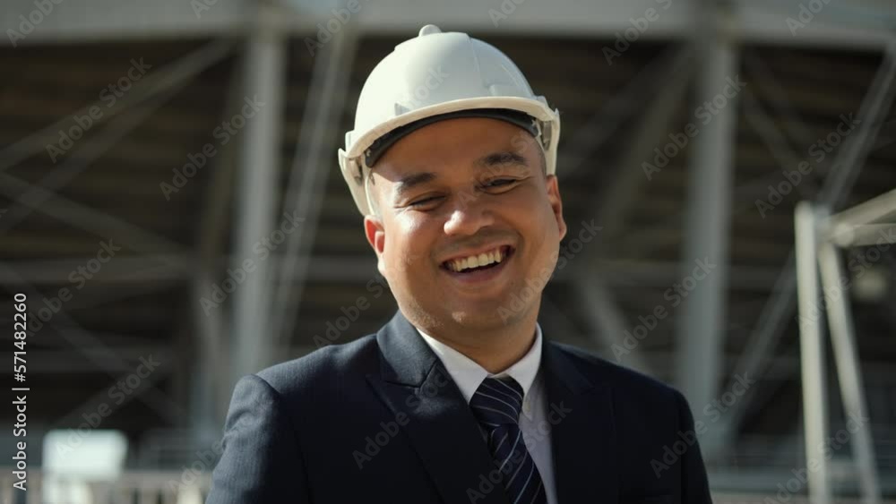 Confident Real estate project manager or architect looking camera in construction site building. Middle eastern Boss CEO, business owner successful Real estate property. Confident Real estate project manager or architect looking camera in construction site building. Middle eastern Boss CEO, business owner successful Real estate property.
