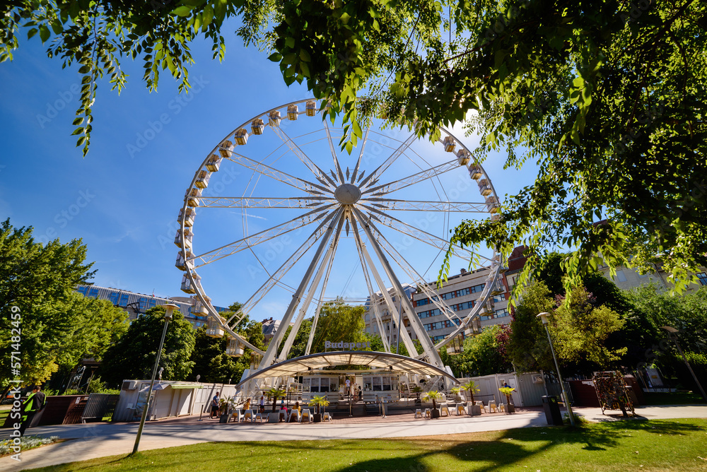 Fototapeta premium Budapest Eye (ferris wheel) at Erzsebet Square. Luminous Ferris wheel in city. 