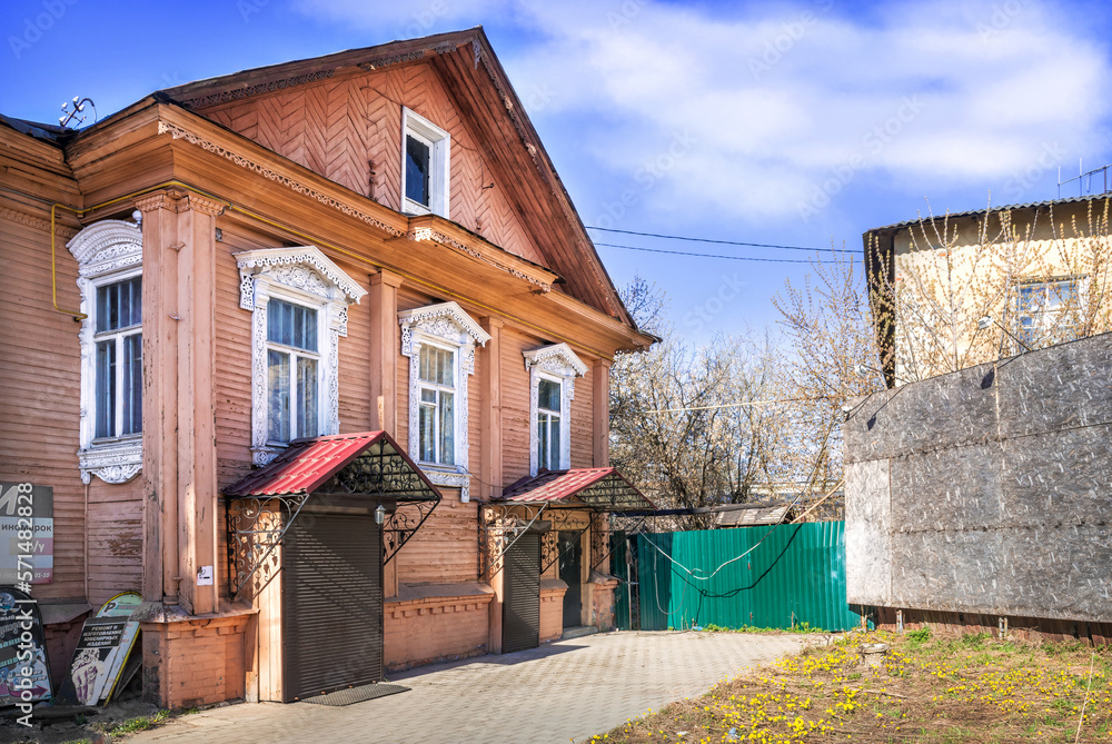 Shops in an old wooden house with openwork architraves, Kineshma, Ivanovo region Shops in an old wooden house with openwork architraves, Kineshma, Ivanovo region