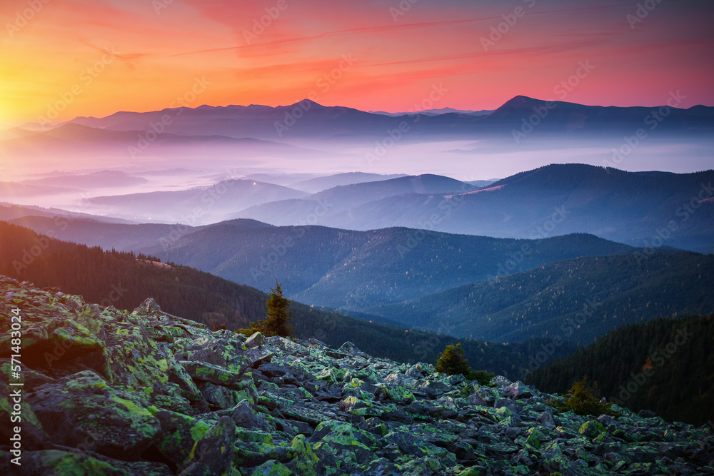 A peaceful view of distant mountain ranges in morning light. Carpathian mountains, Ukraine.