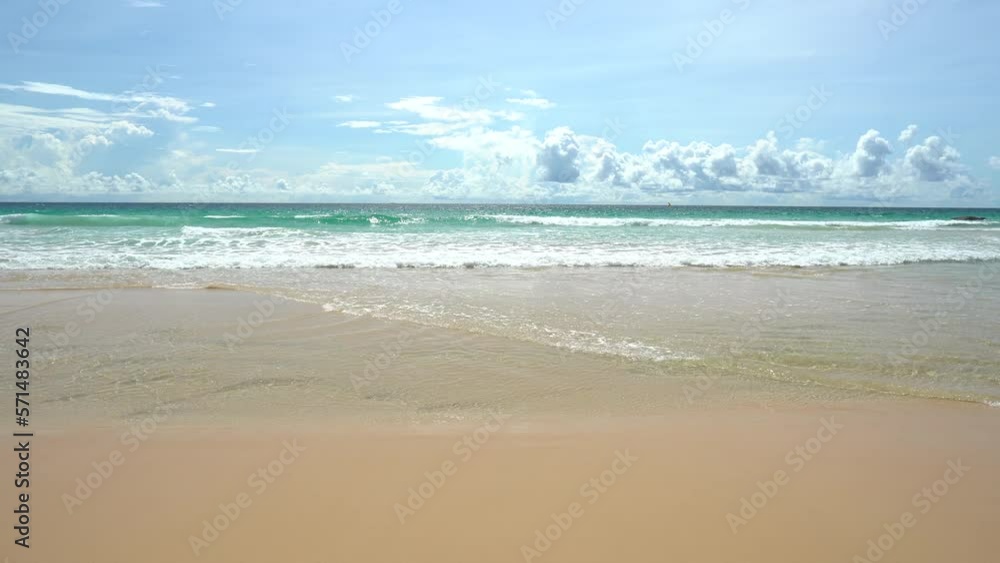 Panorama white sand popular beach waves texture lapping across untouched shore. Panorama white sand popular beach waves texture lapping across untouched shore.