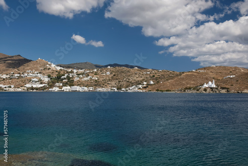 View of the beautiful crystal clear waters of the Tzamaria beach in Ios Greece and the village in the background