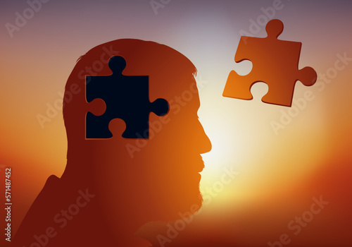 Concept de la perte de mémoire avec un homme dont une pièce de puzzle a été retiré de son crâne, symbole de son cerveau malade.