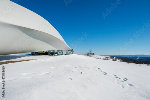 Installation of a wind station. A panoramic view of the blades of a wind generator lying on the ground. © mikhailgrytsiv