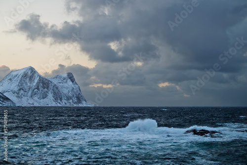 Stormy weather in Northern Norway - waves crashing over island