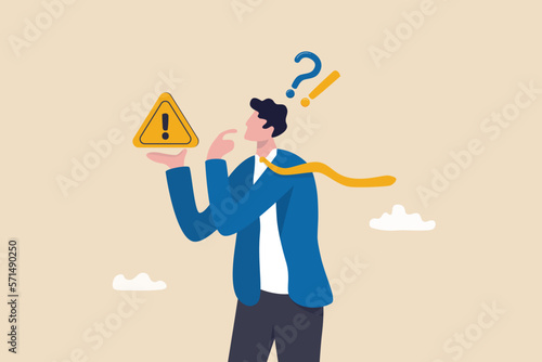 Concern or doubt to make decision, worried for problem or issue, attention or challenge ahead, distrust or trouble concept, businessman holding exclamation mark sign with concern to solve problem.