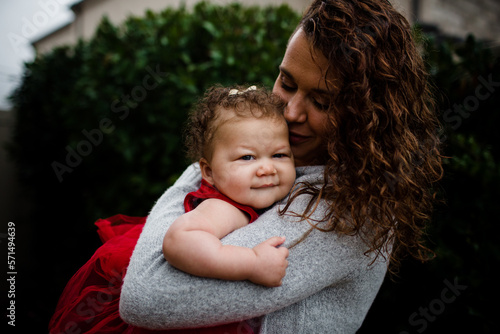 Late Thirties Mother Holding Biracial Baby photo