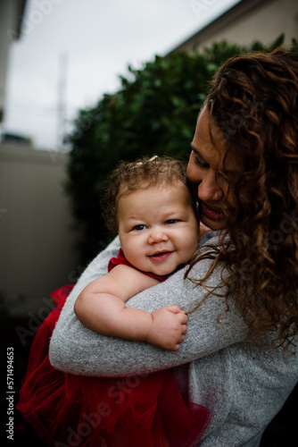 Late Thirties Mother Holding Biracial Baby photo