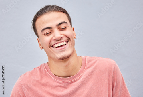 Man, face or laughing on isolated background at funny joke, meme or comedy on grey mockup, model wall or mock up backdrop. Smile, happy or comic student in fashion, trendy style or cool relax clothes