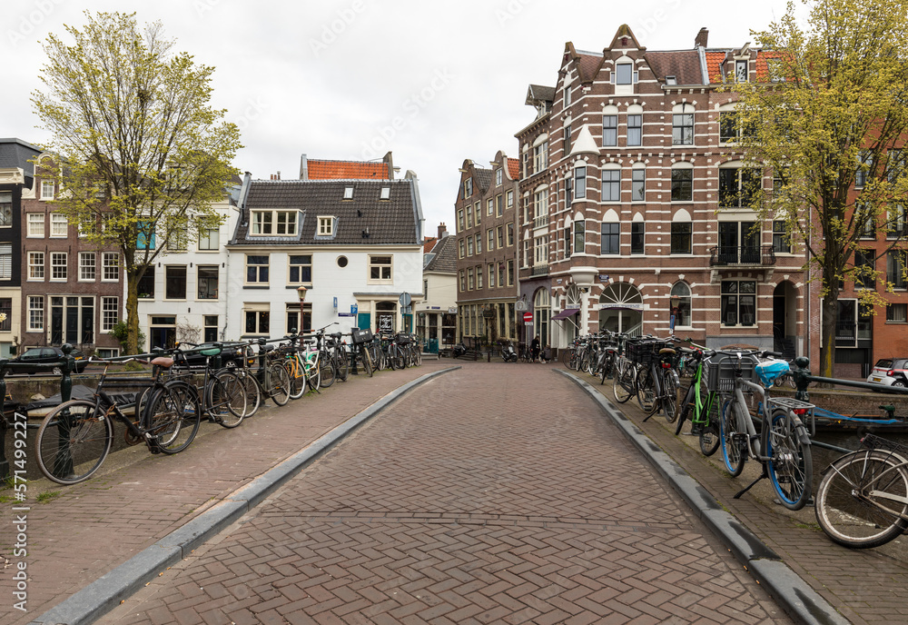  Many bicycle parking in Amsterdam, Netherlands. Bicycle is populat transportation in Amsterdam, Netherlands