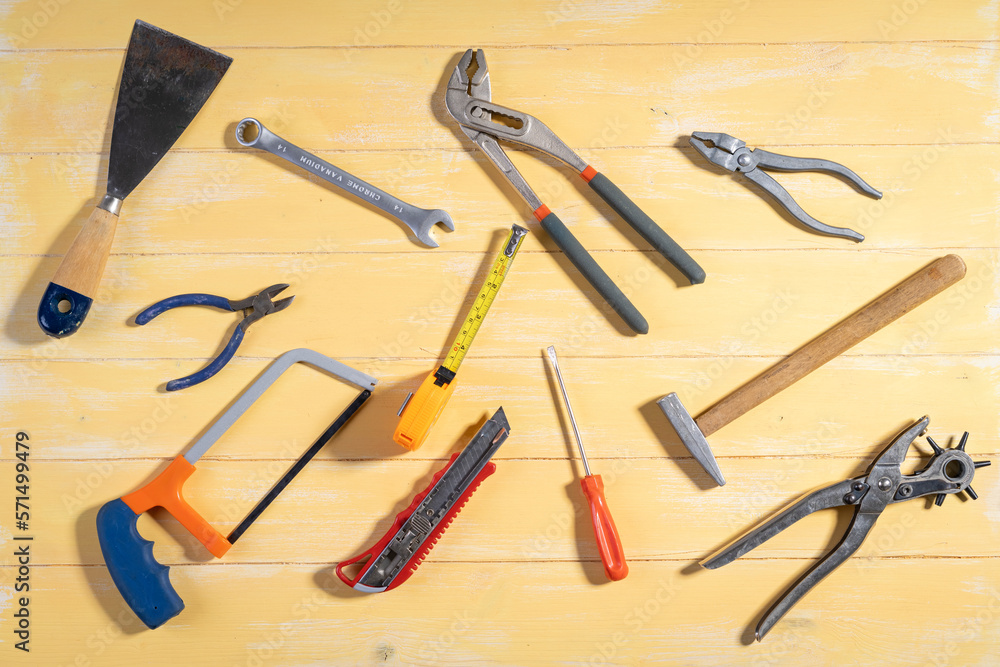 All tools supplies home construction on the yellow wooden background. Building tool repair equipments,copy space,industry engineer tool concept.still-life. All tools supplies home construction on the yellow wooden background. Building tool repair equipments,copy space,industry engineer tool concept.still-life.
